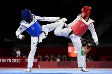 Ruth Gbagbi (protection bleue) en combat au tournoi olympique de Tokyo 2020.